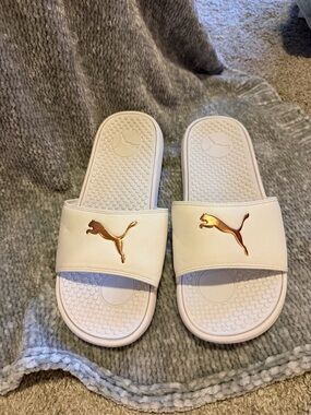 Puma White Slide Sandals with Metallic Rose Gold Logo